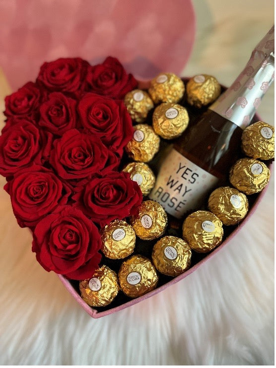 Heart Shaped Box With Red Roses Chocolate And Champagne